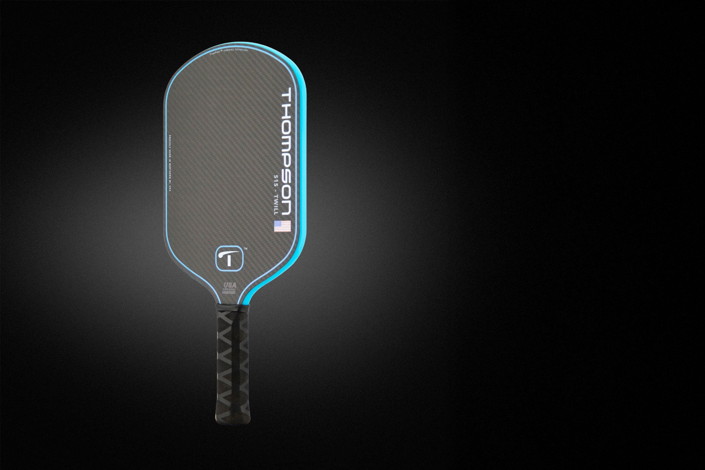 Thompson pickleball paddle on a black background